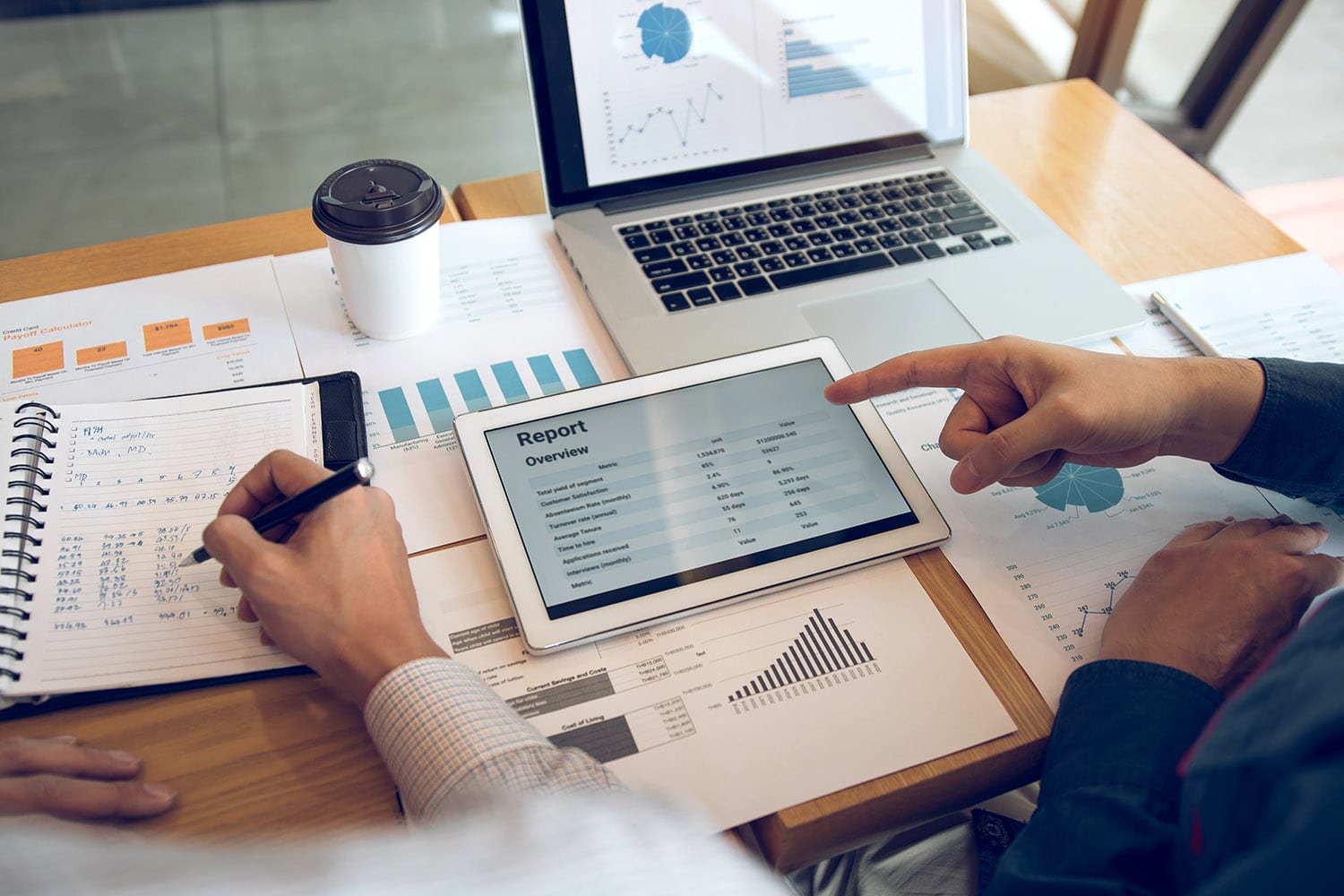 Business partnership coworkers using a tablet to analysis graph