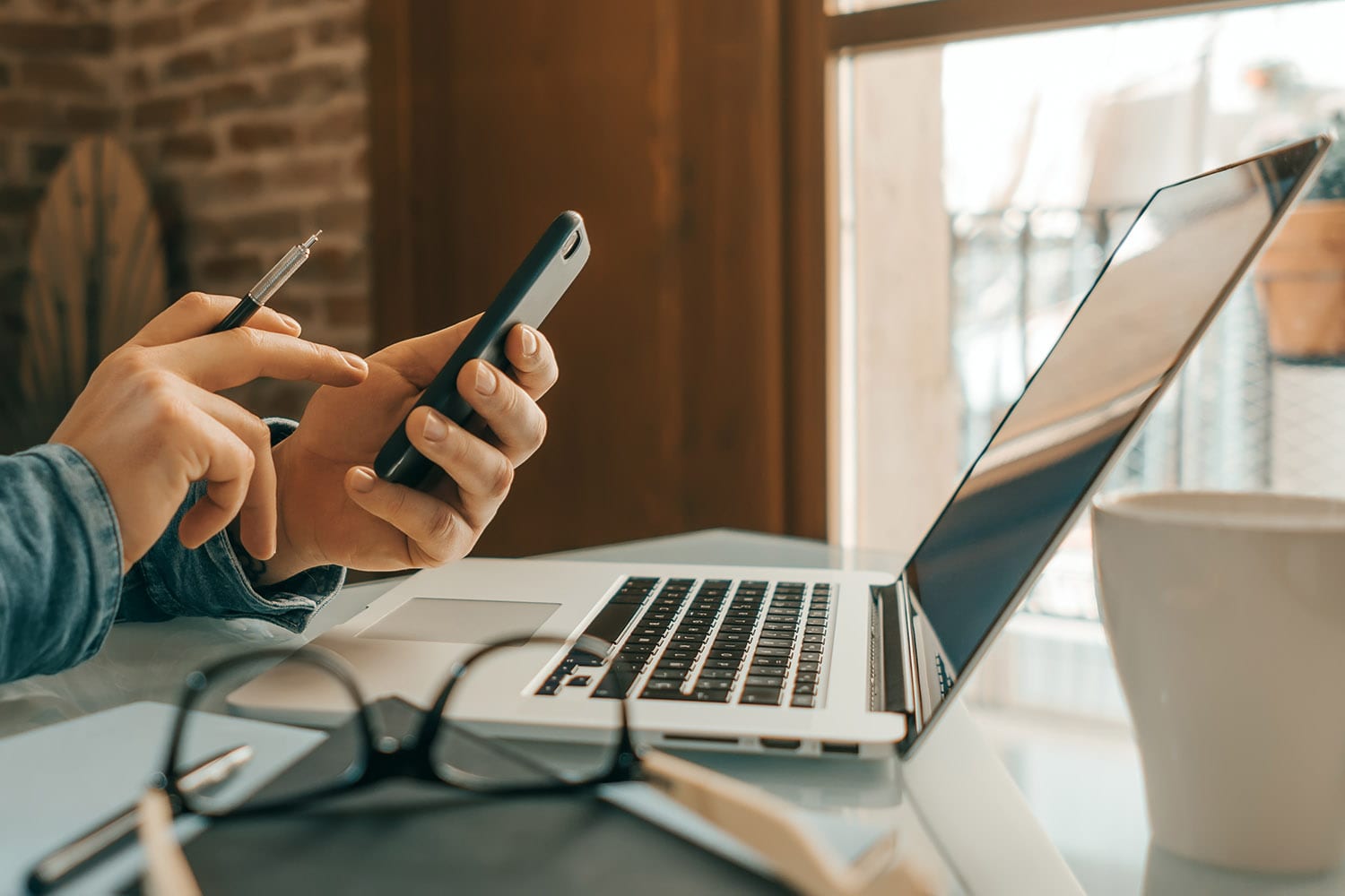 Man pointing on smartphone screen, chatting in social networks,